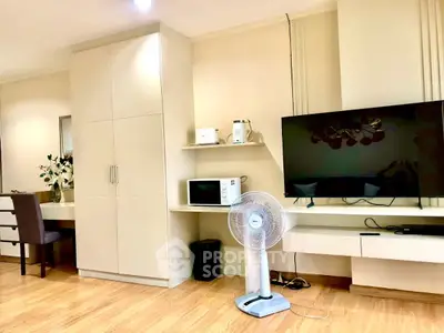 Modern living room with sleek TV setup and stylish furniture