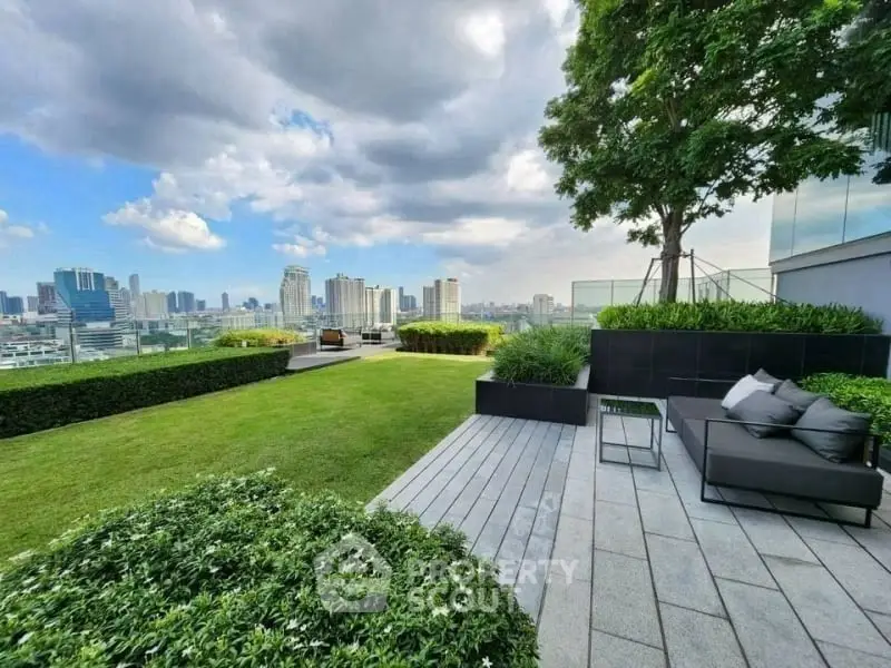 Luxurious rooftop garden with stunning city skyline view and modern seating area.