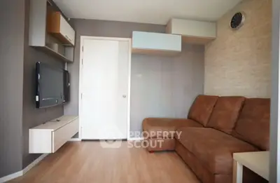 Cozy living room with modern decor and comfortable brown sofa