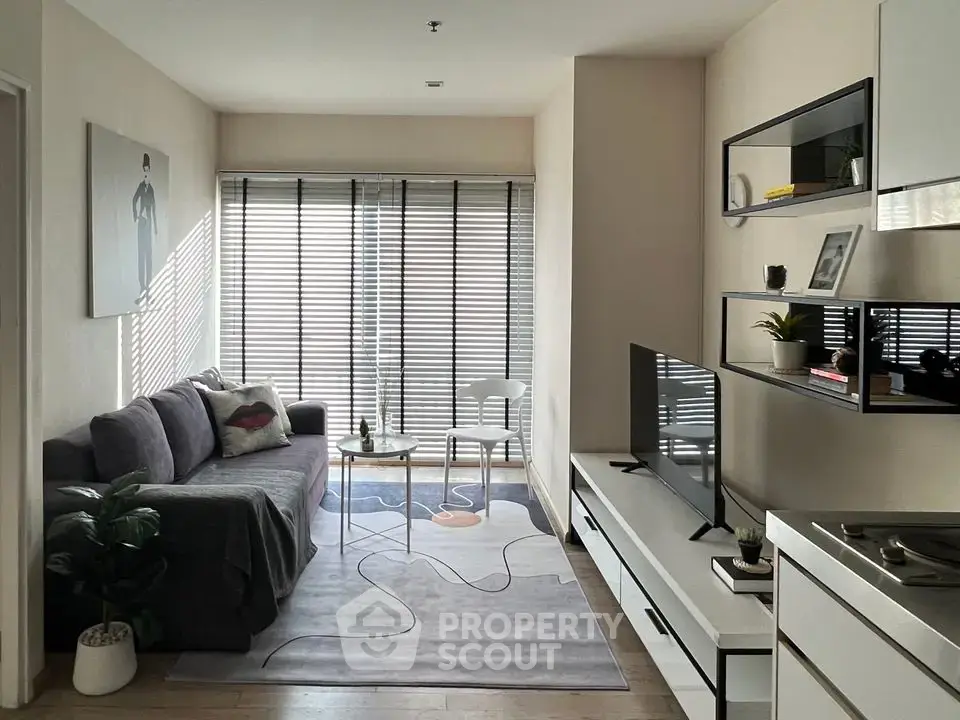 Modern living room with sleek furniture and natural light, perfect for urban living.