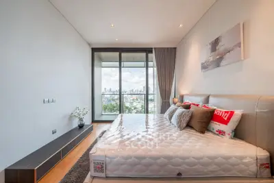 Luxurious bedroom with stunning city view and modern decor
