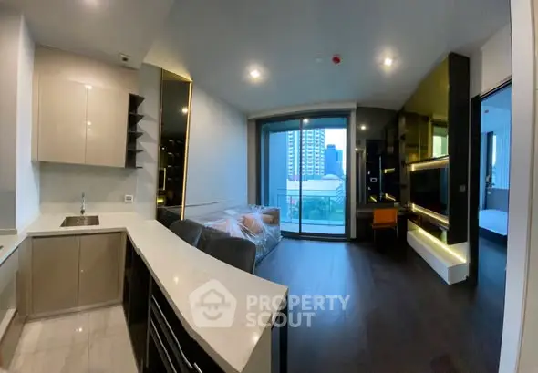 Modern open-plan living room with sleek kitchen and city view balcony.