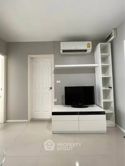 Modern living room with sleek TV unit and air conditioning