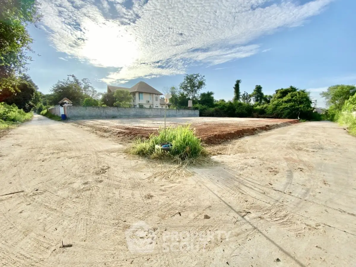 Spacious land plot with clear skies and lush surroundings, ideal for development opportunities.