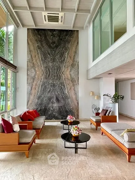 Luxurious living room with high ceiling and elegant decor