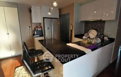 Modern kitchen with sleek countertops and stylish bar seating
