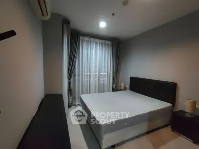 Modern bedroom with minimalist design and large window for natural light