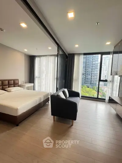 Spacious modern bedroom with city view and elegant furnishings