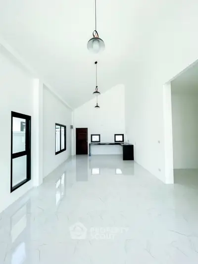 Spacious modern living room with high ceilings and sleek design