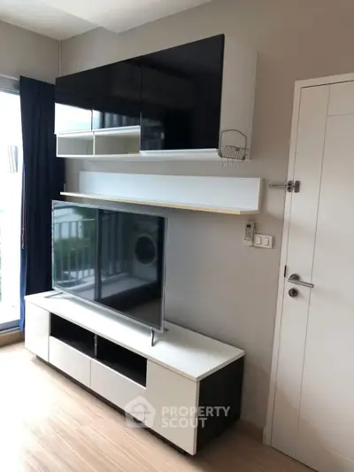 Modern living room with sleek TV unit and stylish storage solutions