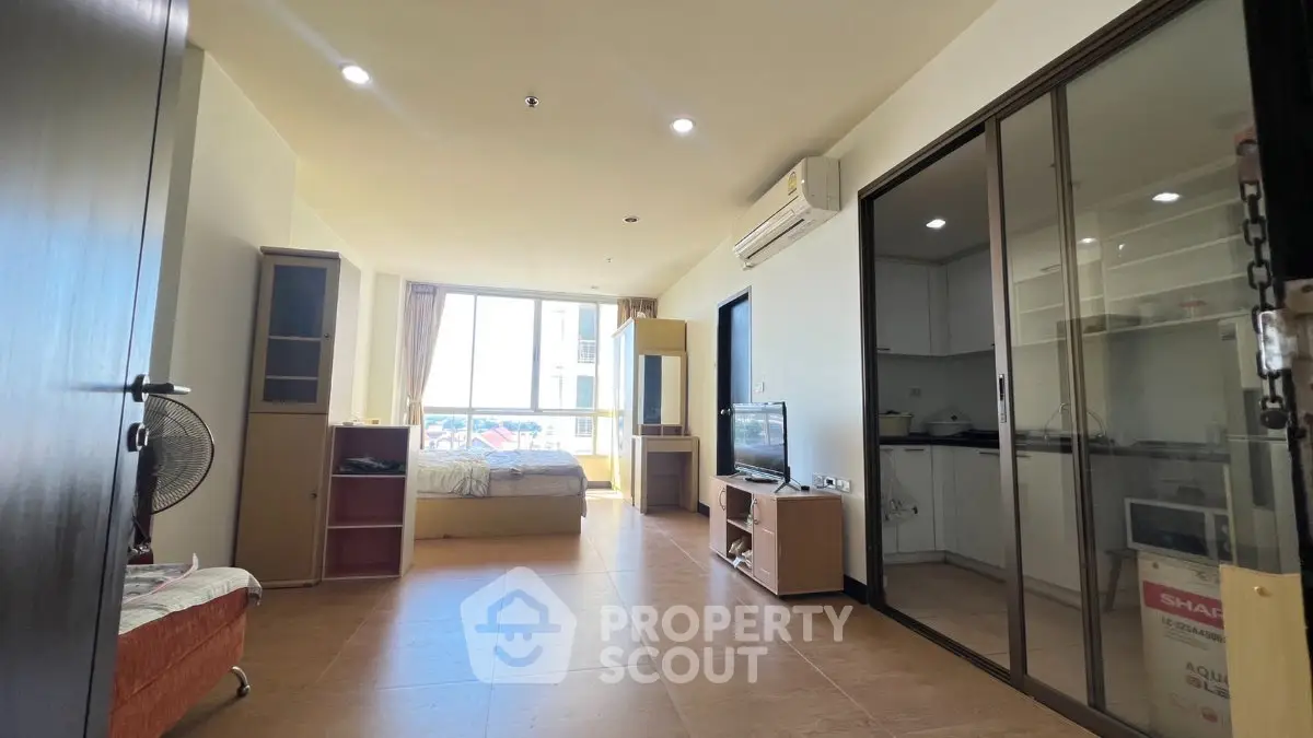 Spacious studio apartment with modern furnishings and natural light