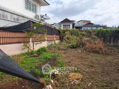 Spacious backyard with potential for landscaping in suburban home