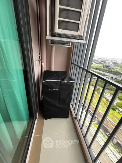 Modern balcony with city view and air conditioning unit, perfect for urban living.