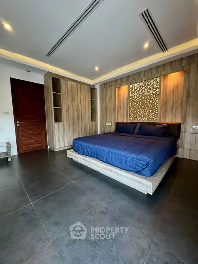 Luxurious modern bedroom with stylish wooden accents and elegant lighting