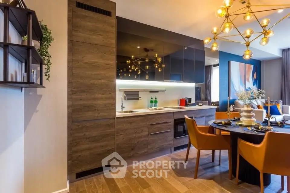 Modern kitchen with stylish dining area and elegant lighting