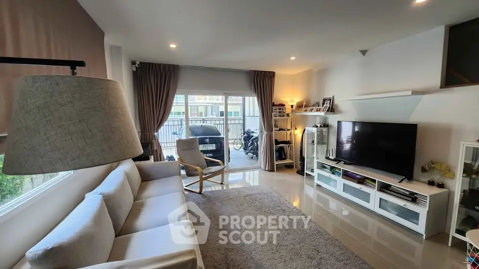 Spacious modern living room with large windows and stylish furniture