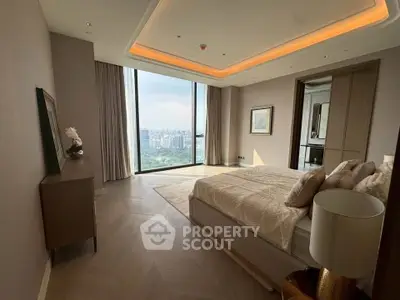 Luxurious bedroom with panoramic city view and elegant decor