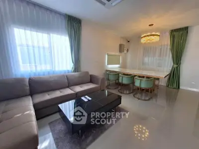 Spacious living room with elegant dining area and modern decor