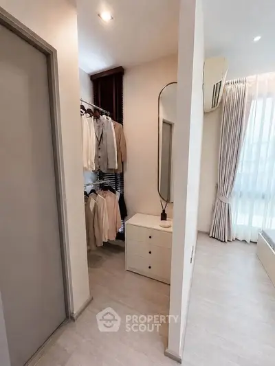 Elegant bedroom with walk-in closet and natural light