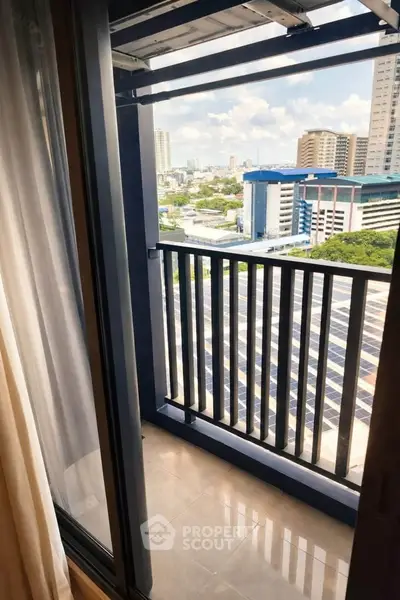 Charming balcony with city view, perfect for relaxing and enjoying the skyline.