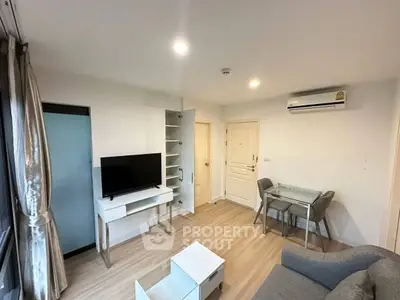Modern living room with sleek furniture and air conditioning in a cozy apartment.