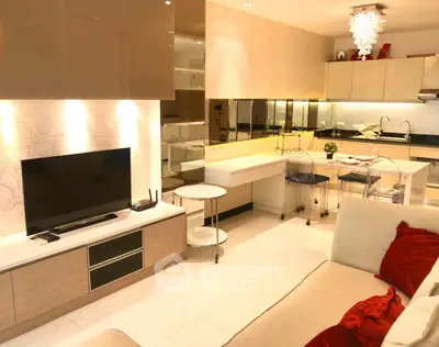 Modern living room with open kitchen, sleek design and elegant lighting