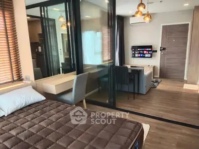Modern studio apartment with open layout, featuring stylish decor and natural light.
