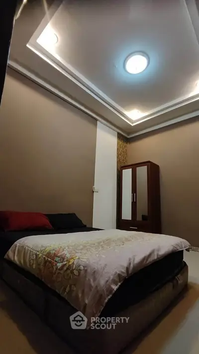 Cozy bedroom with modern ceiling lights and elegant decor