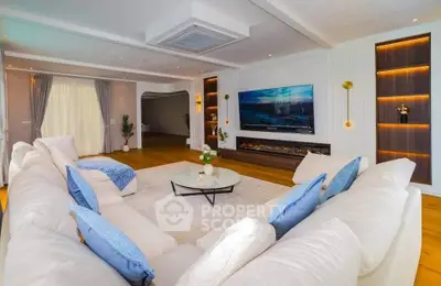 Luxurious living room with elegant decor, large sectional sofa, and modern fireplace, perfect for relaxation.