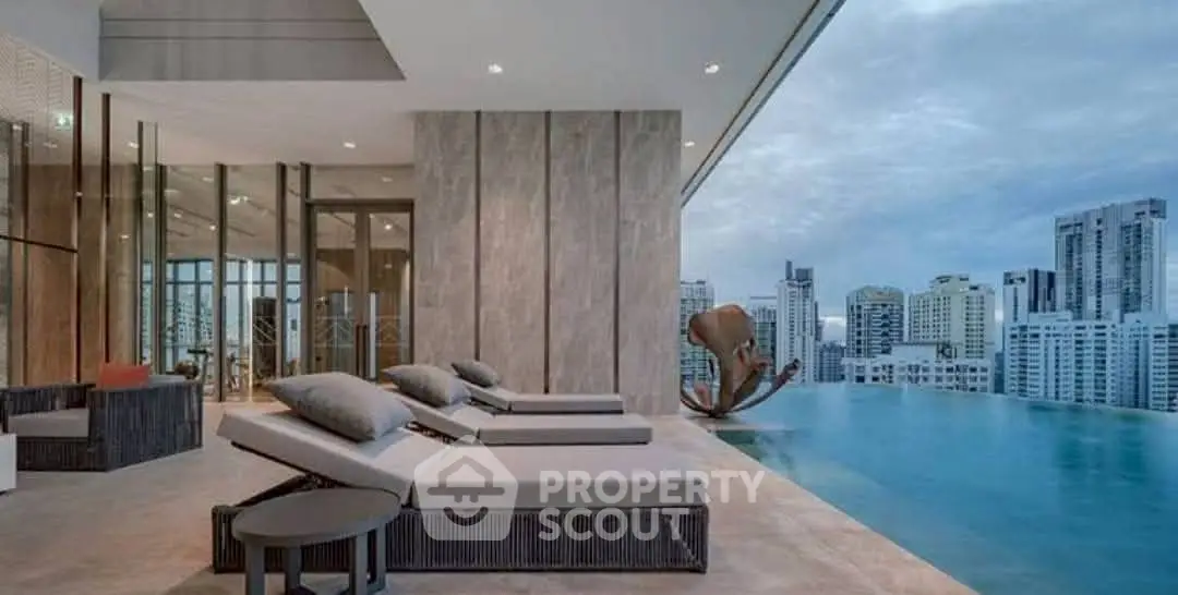 Luxurious rooftop pool with stunning city skyline view and modern lounge chairs.