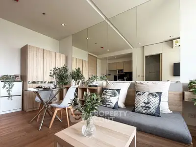 Modern living room with stylish decor and open kitchen layout
