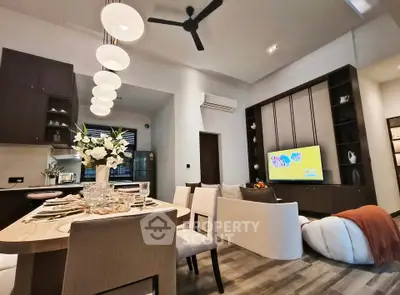 Modern open-plan living room with elegant dining area and stylish decor