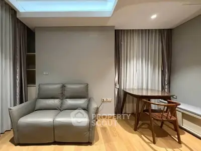 Modern living room with sleek leather sofa and elegant wooden table, perfect for stylish urban living.