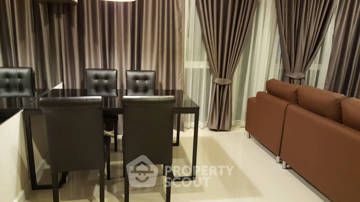 Modern living room with sleek dining area and stylish curtains