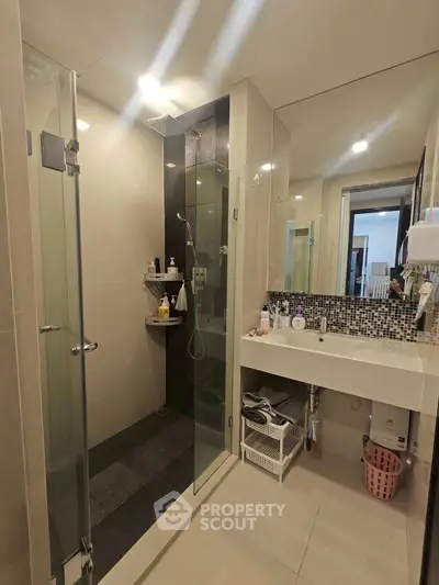 Modern bathroom with glass shower and stylish sink area