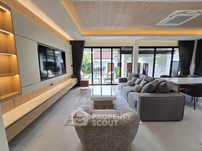 Luxurious modern living room with large windows and stylish furniture