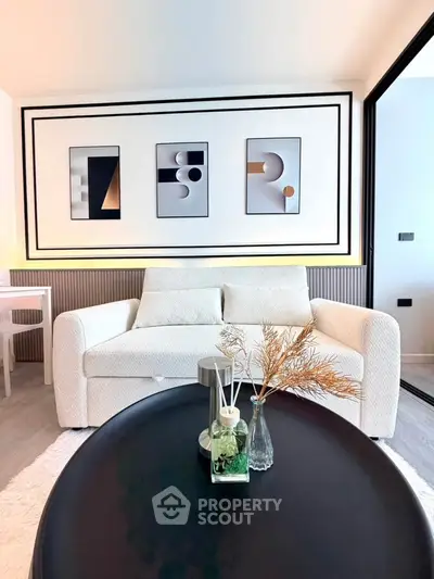 Modern living room with stylish decor and comfortable white sofa