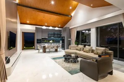 Luxurious open-plan living room with modern kitchen and elegant decor