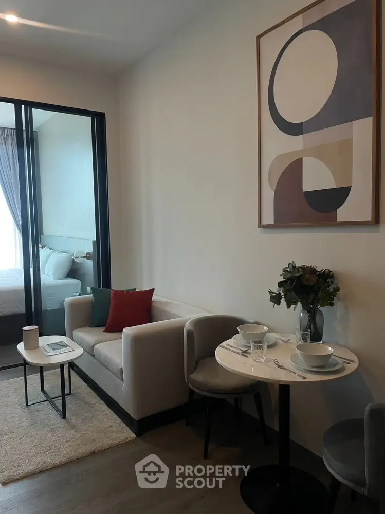Modern living room with cozy sofa and stylish decor in a contemporary apartment.