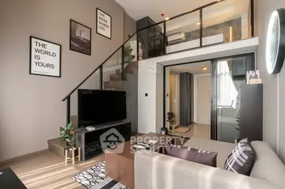 Modern living room with stylish decor and mezzanine level in a contemporary apartment.