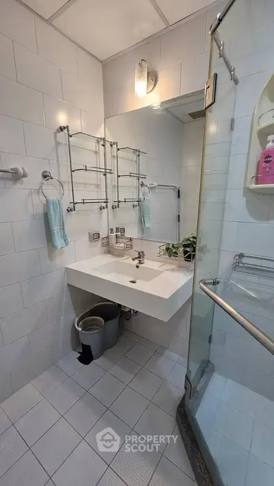 Modern bathroom with glass shower and sleek fixtures