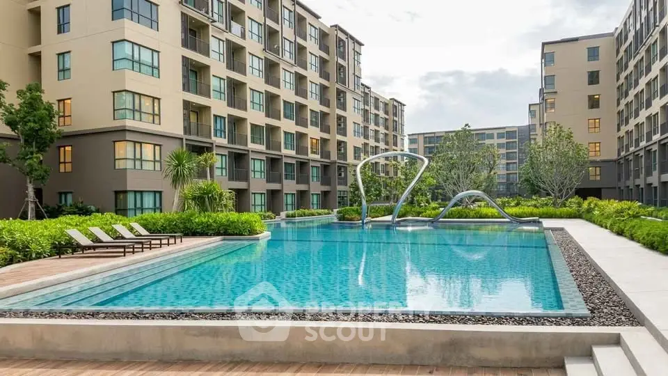 Modern apartment complex with a luxurious outdoor pool and landscaped garden.