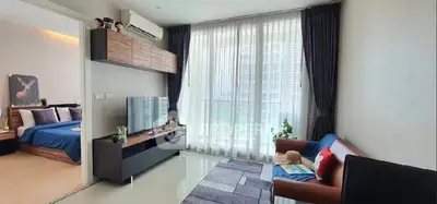 Modern living room with sleek furniture and large window for natural light