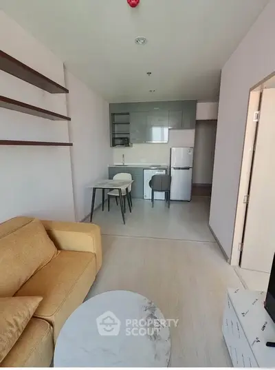 Modern living room with open kitchen and stylish furniture