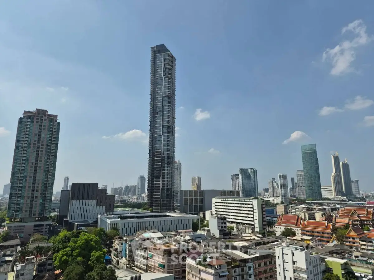 Stunning cityscape view showcasing modern skyscrapers and urban skyline under a clear blue sky.