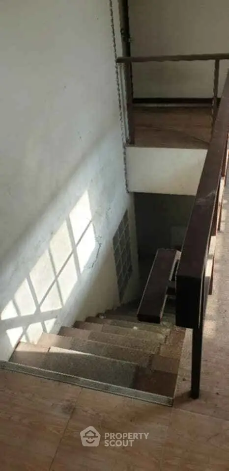 Spacious stairway with natural light in a residential building