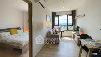 Modern studio apartment with cozy living area and scenic window view