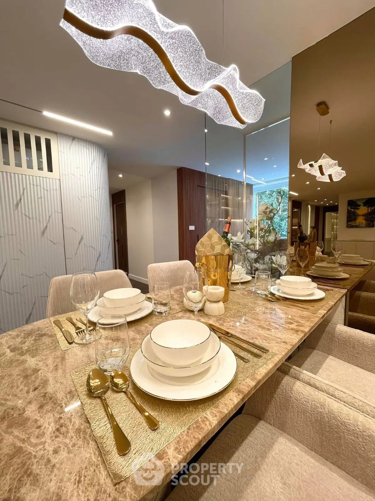 Luxurious dining area with elegant table setting and modern lighting
