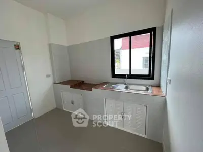Modern kitchen with sleek countertops and ample storage space