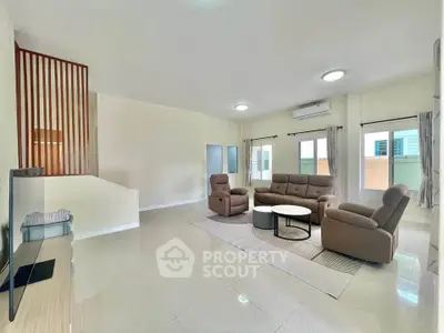 Spacious living room with modern furniture and natural light